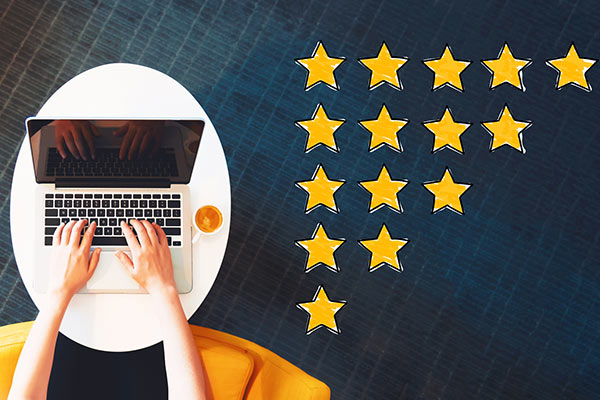 A laptop and a pyramid of stars as in for rating